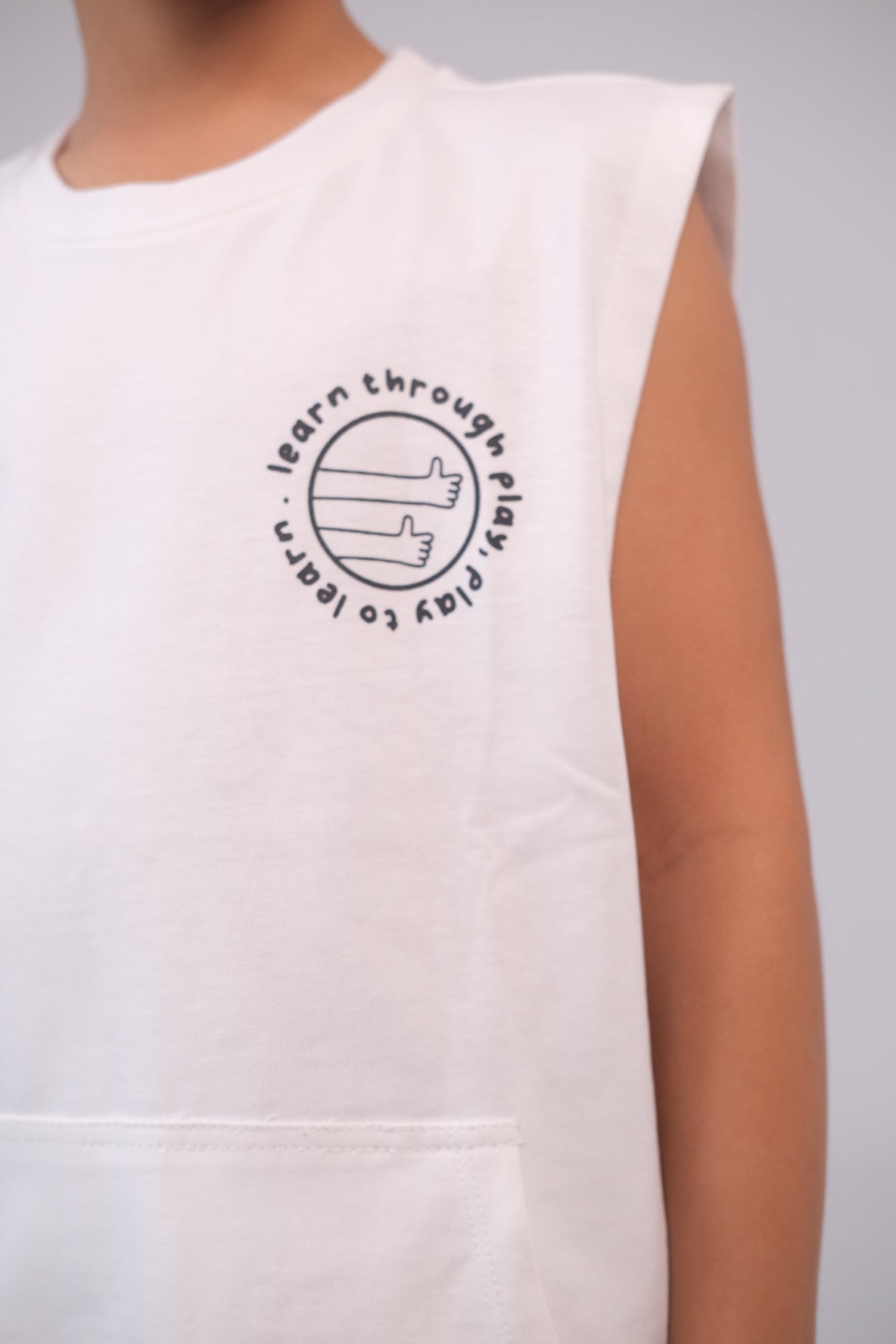 Unisex Sleeveless Cotton T-Shirt – White "Learn Through Play" Design