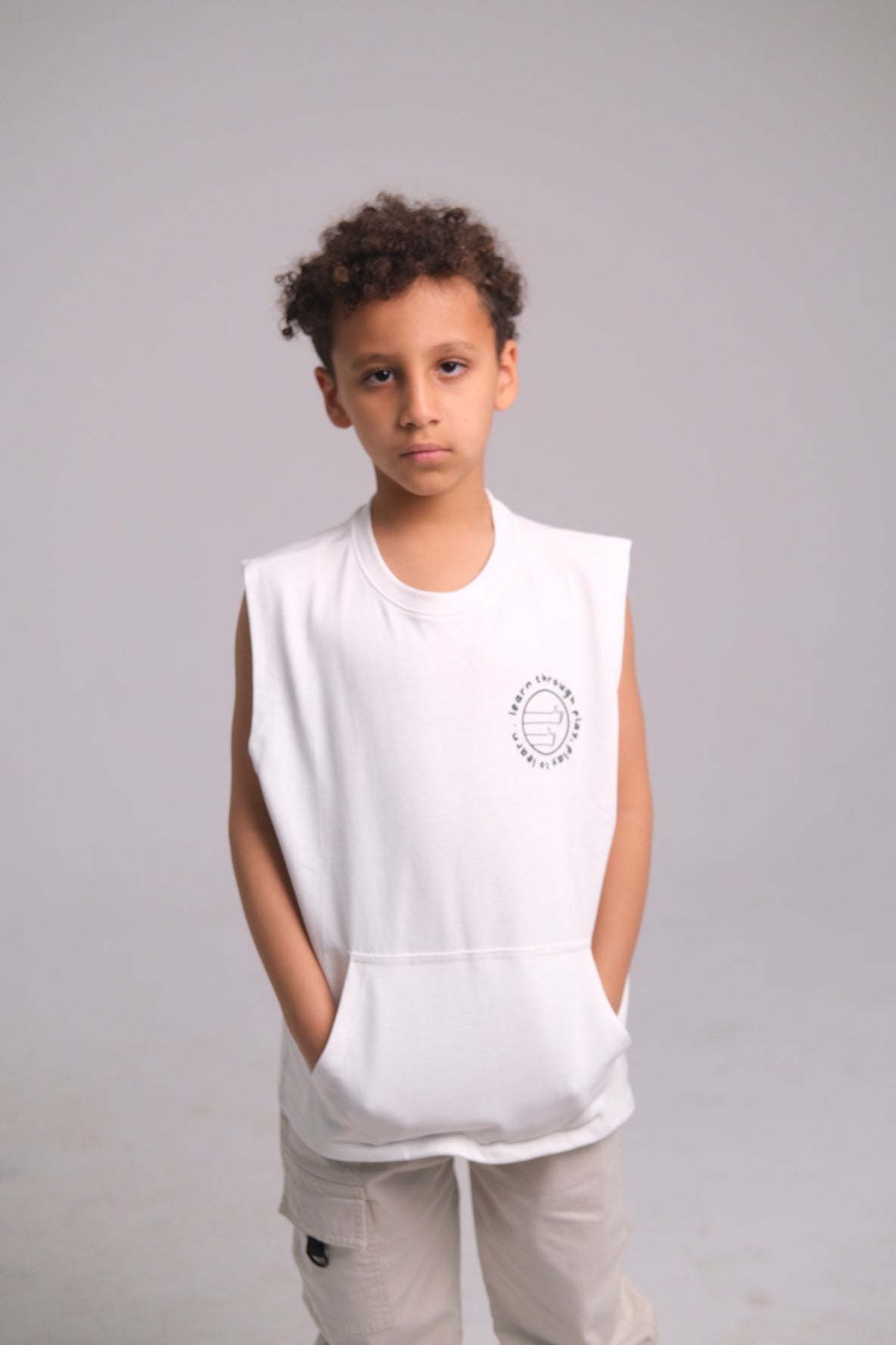 Unisex Sleeveless Cotton T-Shirt – White "Learn Through Play" Design