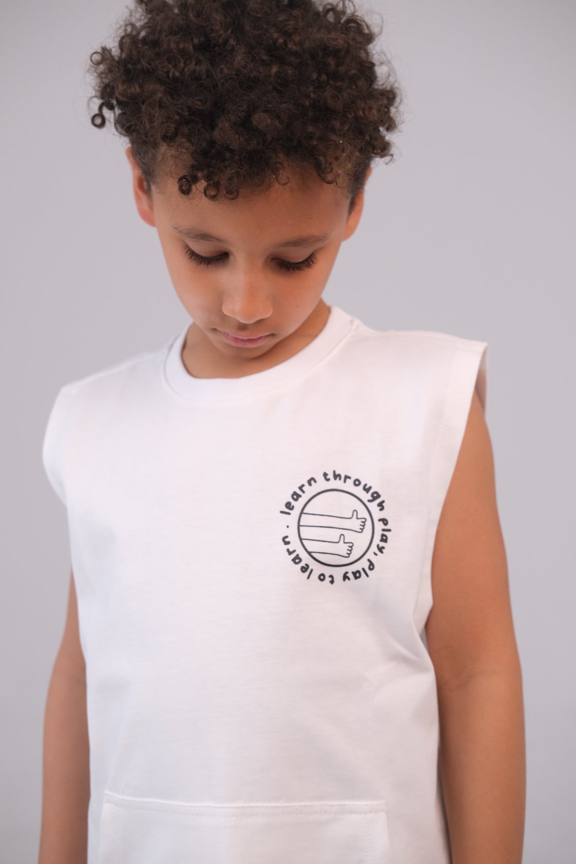 Unisex Sleeveless Cotton T-Shirt – White "Learn Through Play" Design
